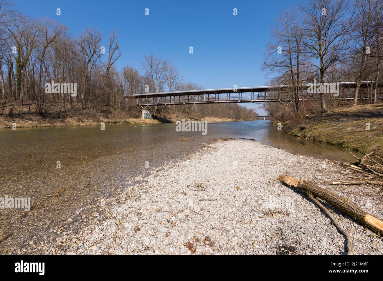 Isar river with St Emmeram bridge at Englischer Garten park, Munich
