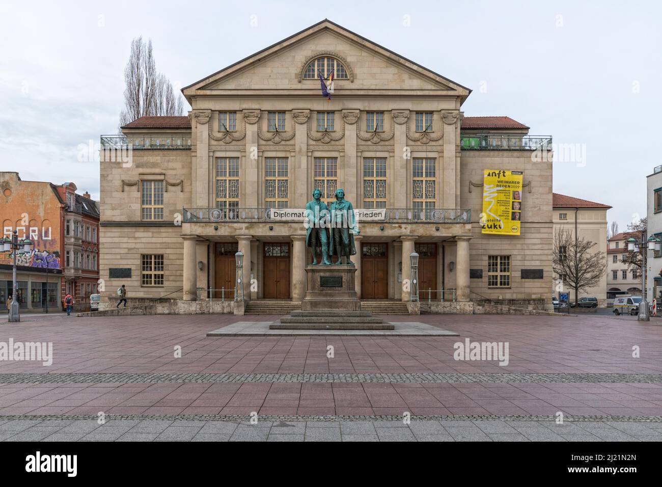 National Theatre with monument for Johann Wolfgang von Goethe and Friedrich Schiller at Weimar, Thuringia, Germany Stock Photo