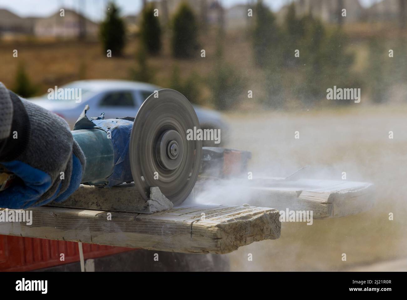 Master cuts the marble stones using an angle grinder Stock Photo Alamy