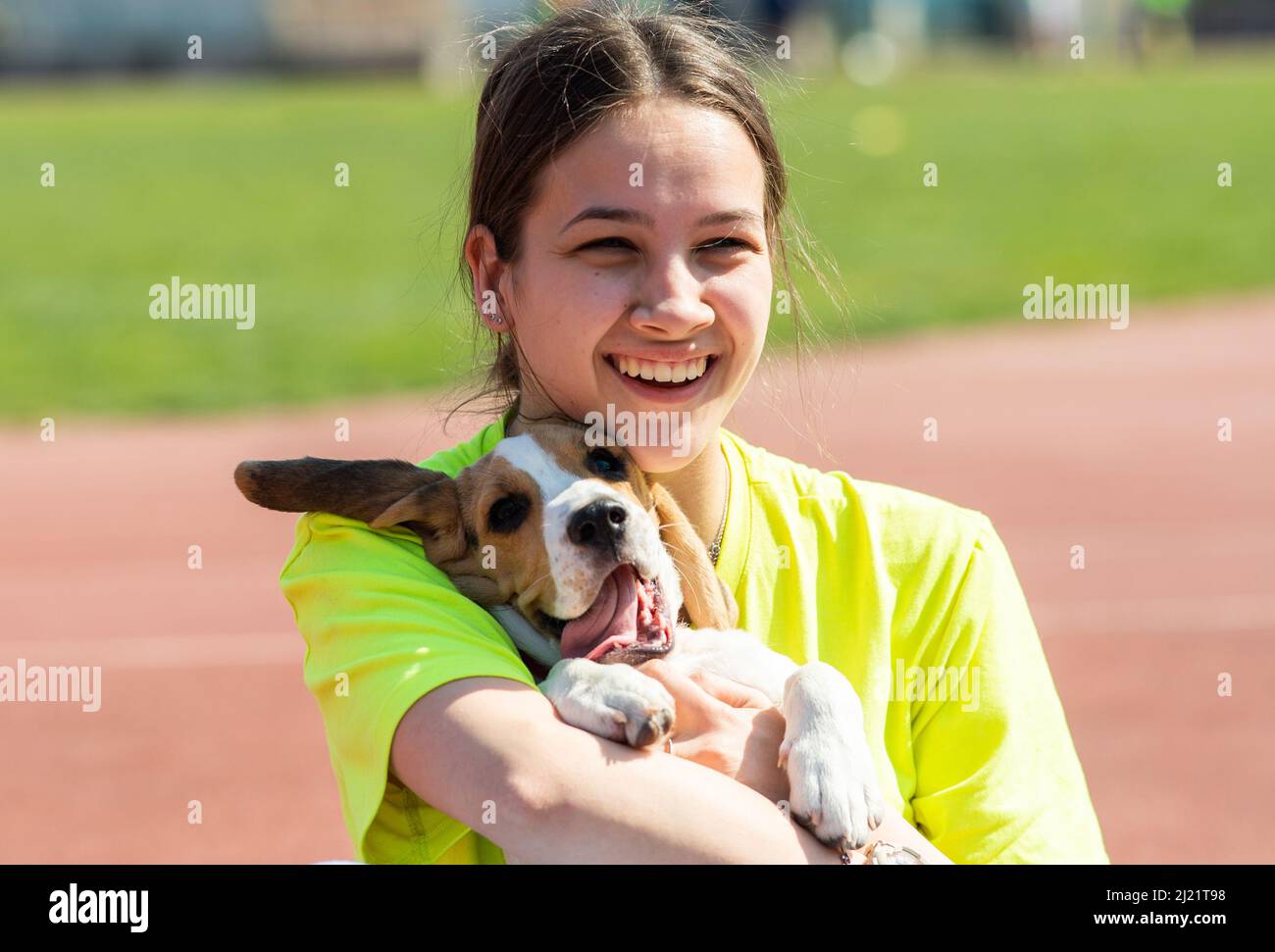 Young girl hugging her dog outdoors in outdoor Stock Photo - Alamy