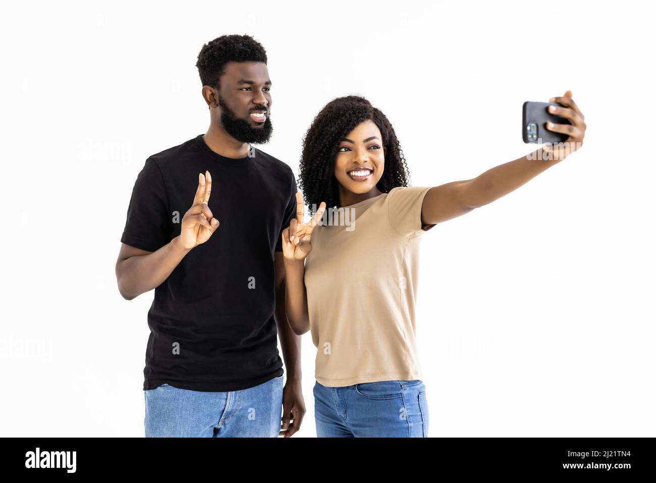 Portrait of a two joyful young african couple isolated over white ...