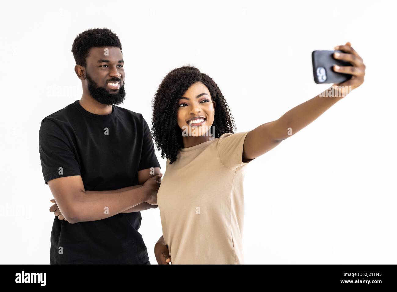 Portrait of a two joyful young african couple isolated over white ...