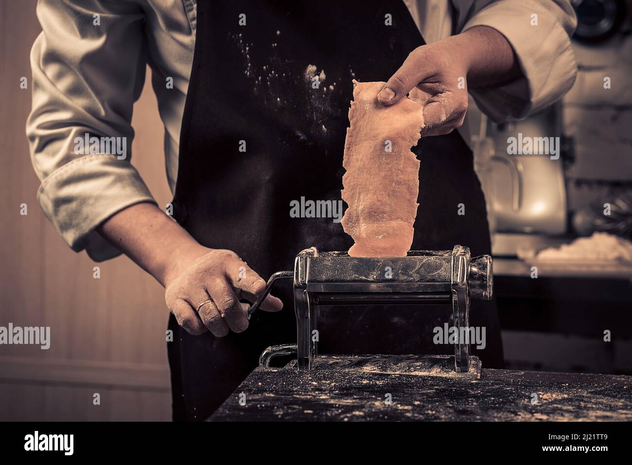 The chef makes fresh spaghetti from scratch. Stock Photo