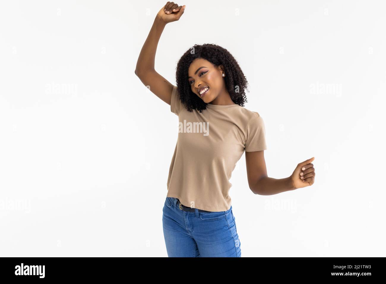 Happy African American woman dancing with her hair flying Stock Photo ...