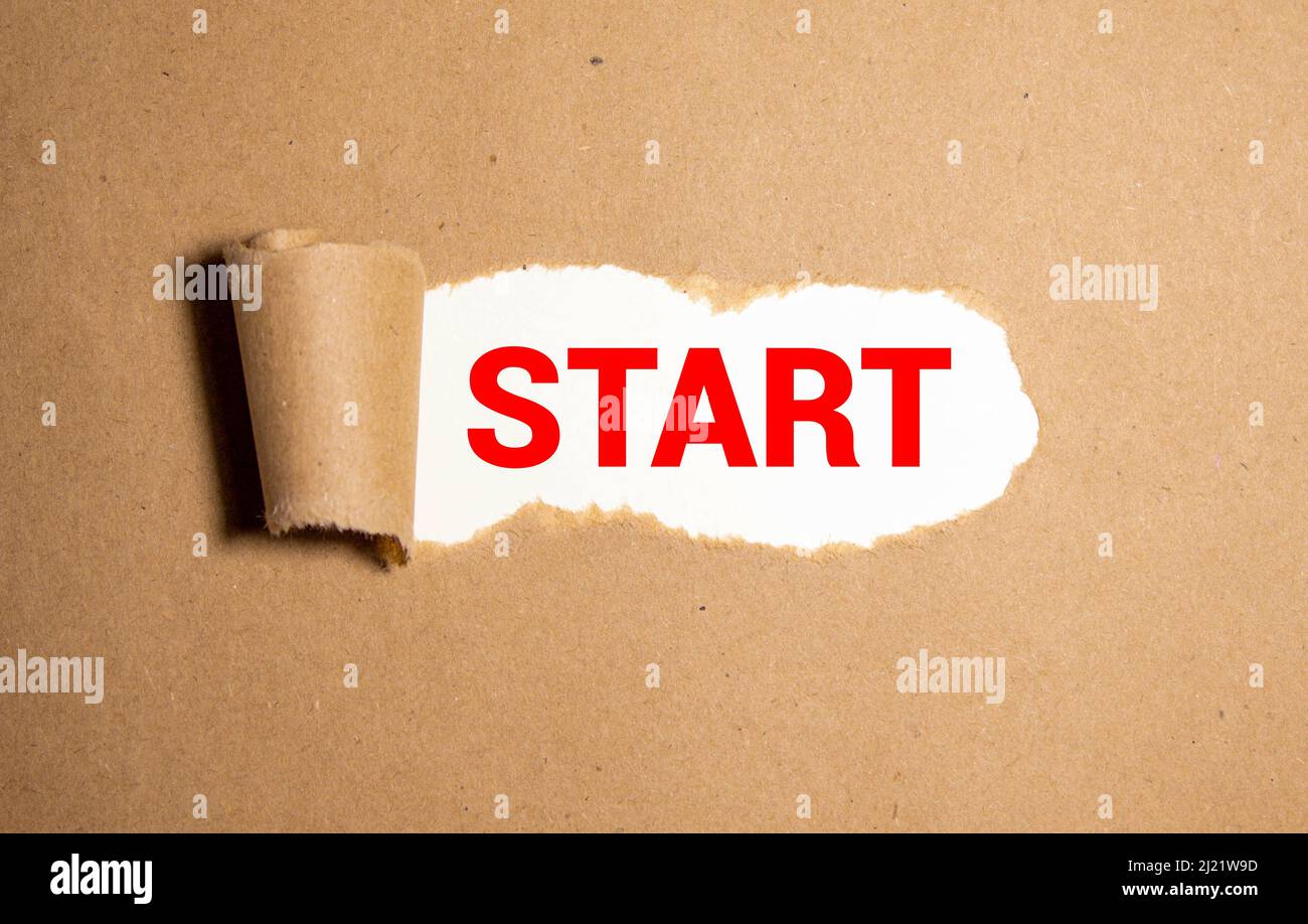 The word start written on torn paper. concept Stock Photo Alamy
