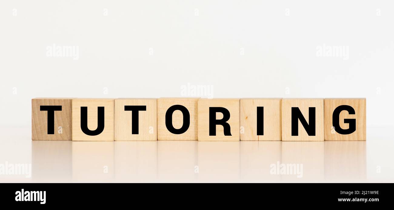 TUTORING word on block concept, education concept Stock Photo Alamy