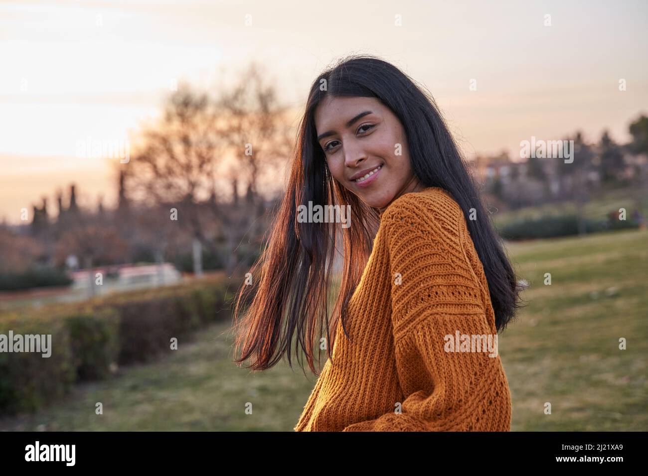 Portrait of young latin woman looking at the camera. Young Venezuelan woman with long hair Stock Photo