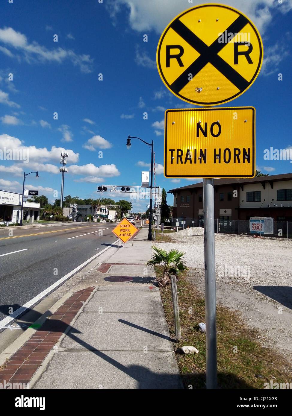 Road Signs at Train Crossway Stock Photo