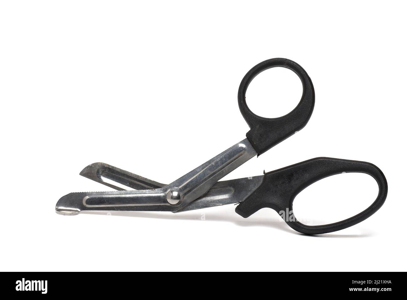 Close up of slightly opened blunt metal bandage scissors with black handles for safe cutting of wound dressings when treating injuries on white backgr Stock Photo