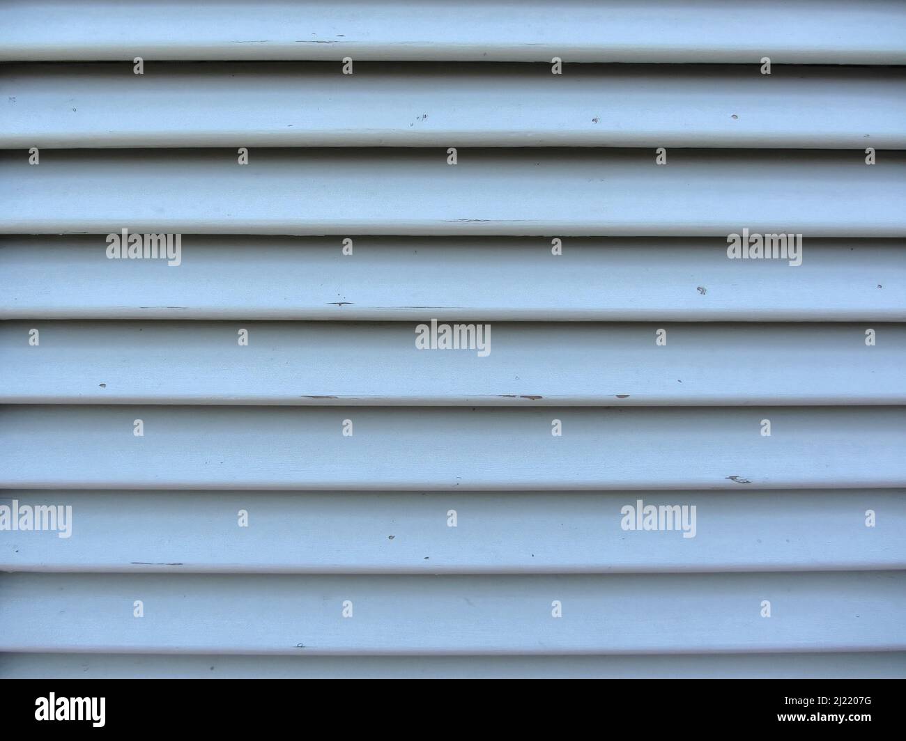 Old jalousie window with wooden slats gray painted texture Stock Photo