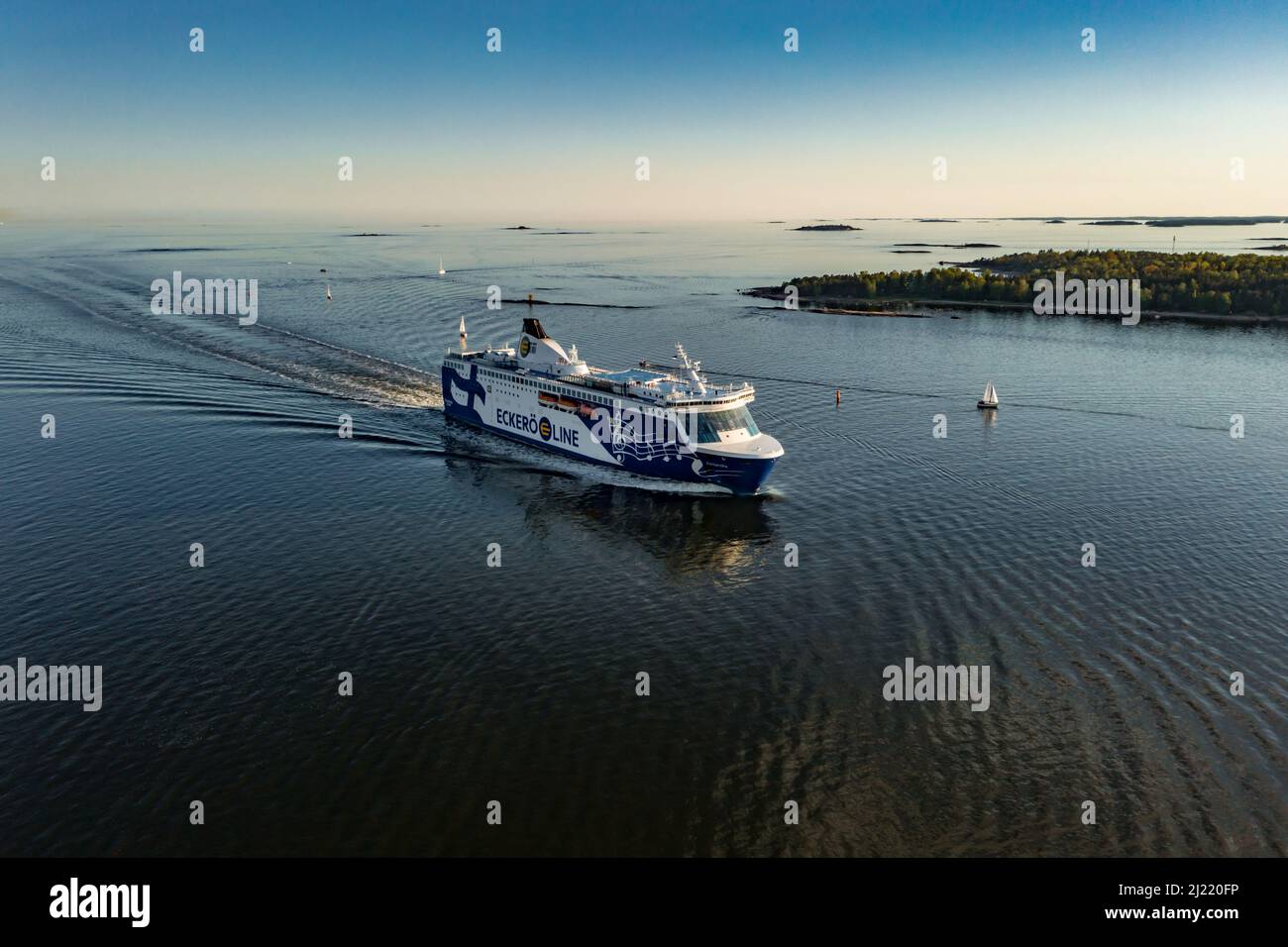 Aerial view following the Eckero line cruiseliner ship, moving towards the Helsinki, Finland Stock Photo