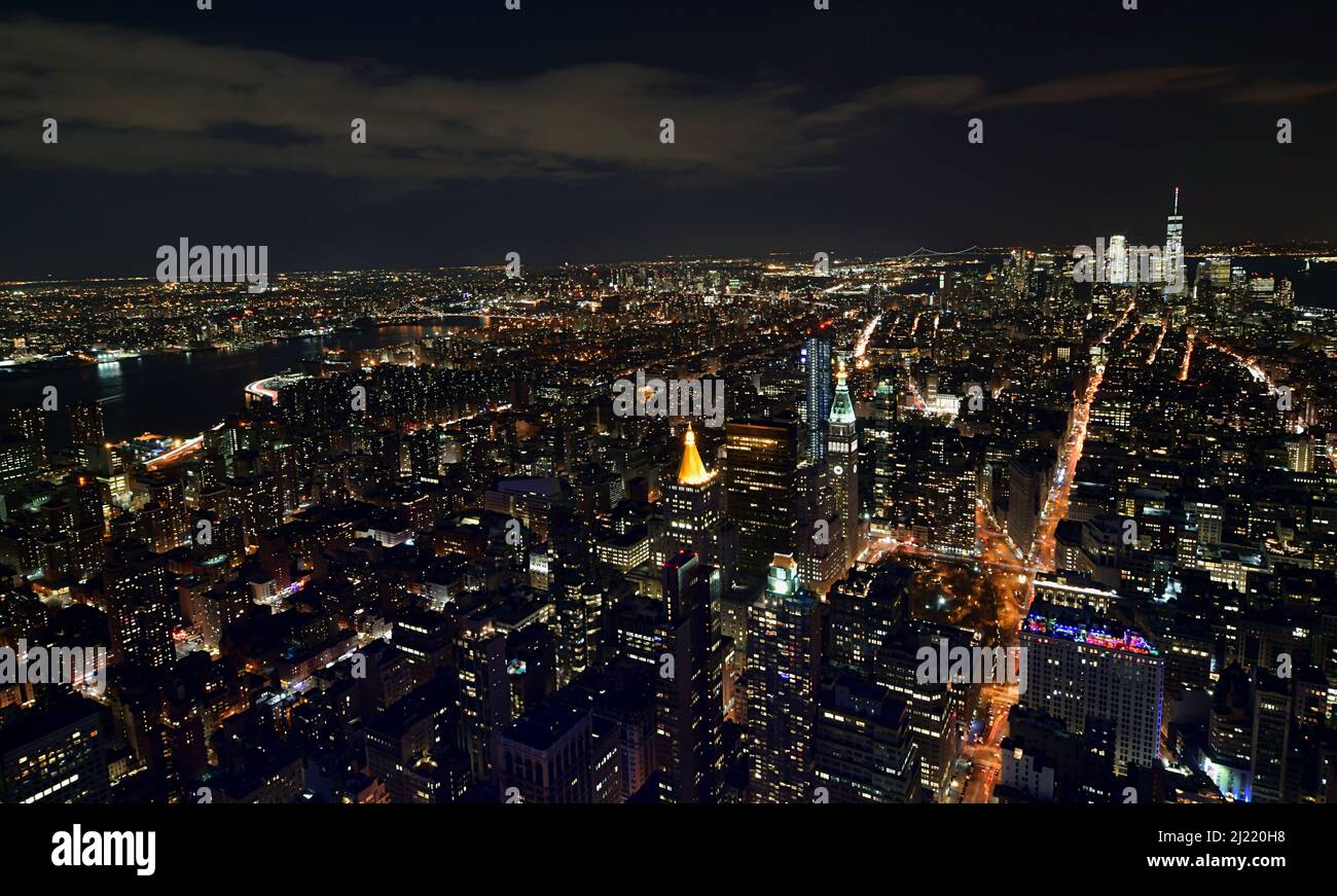 An aerial view of the illuminated New York City during night, United ...