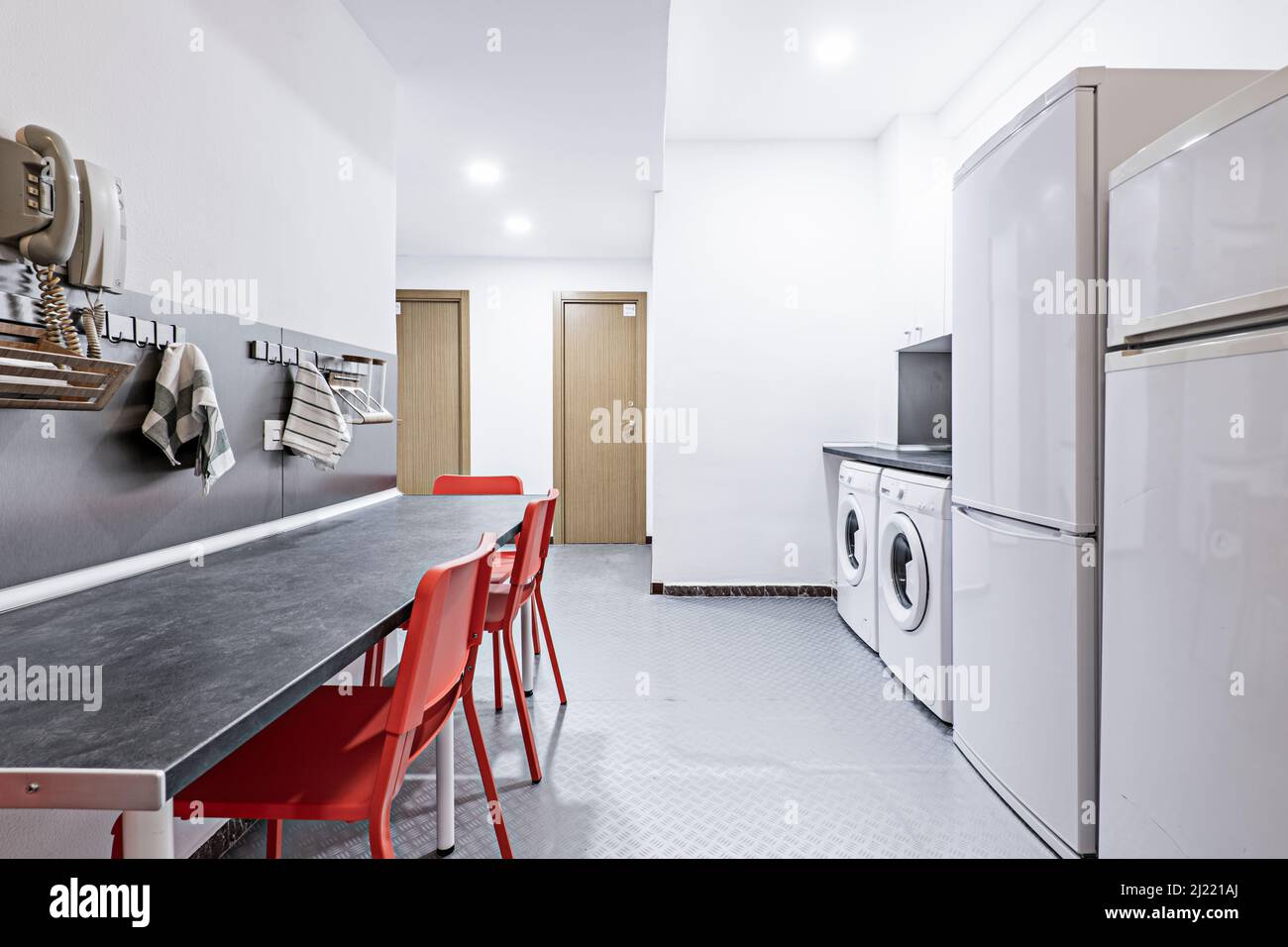 Kitchen with two fridges and two washing machines in a student flat Stock Photo