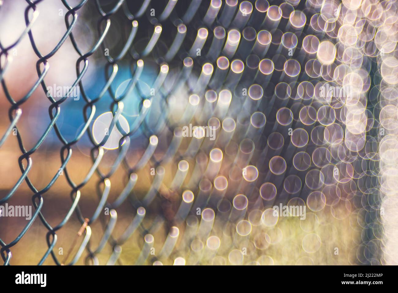 Old rusty metal wire mesh outdoor defocus background, blurred texture, soft focus vintage lens Stock Photo