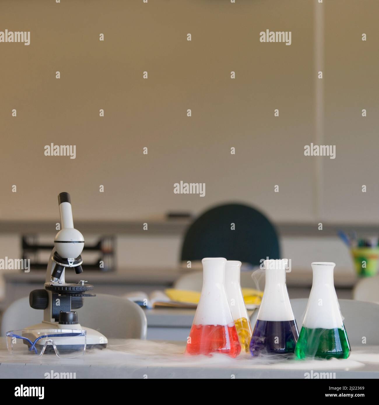 Chemistry equipment on laboratory bench, microscope and beakers Stock ...