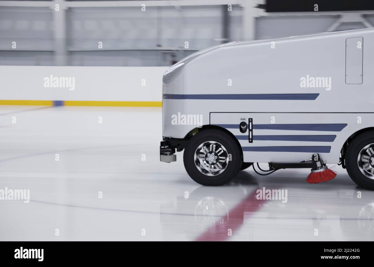 Zamboni ice resurfacing machinery, smoothing and repairing ice rink ...