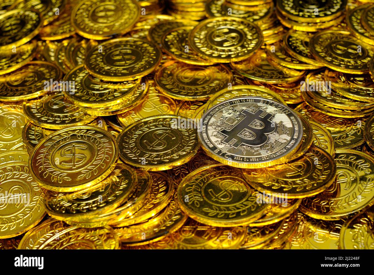 Golden bitcoin cryptocurrency on pile gold coins a lot of Stock Photo -  Alamy