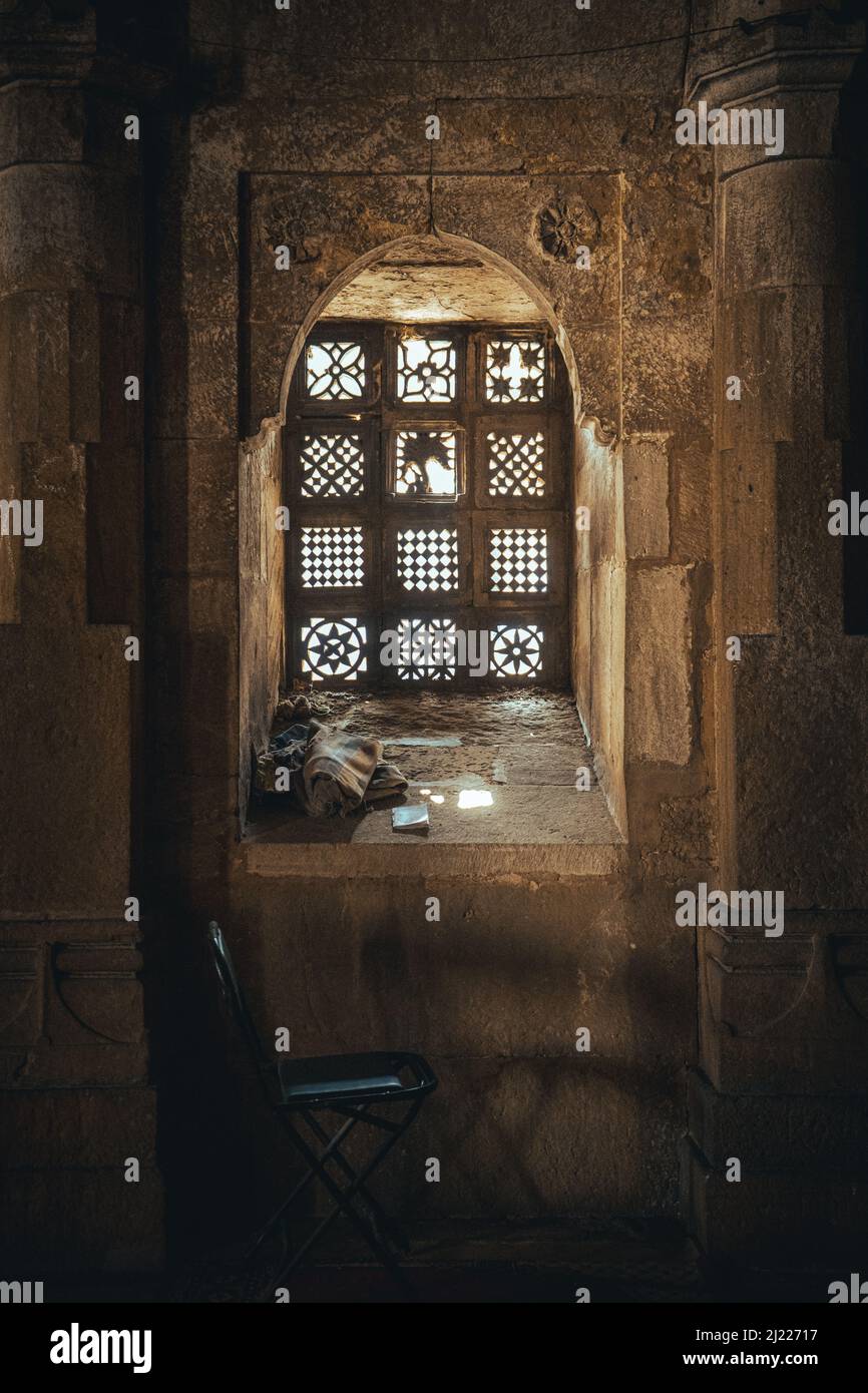 A vertical shot of an interior window of a building with a gothic architectural style Stock Photo