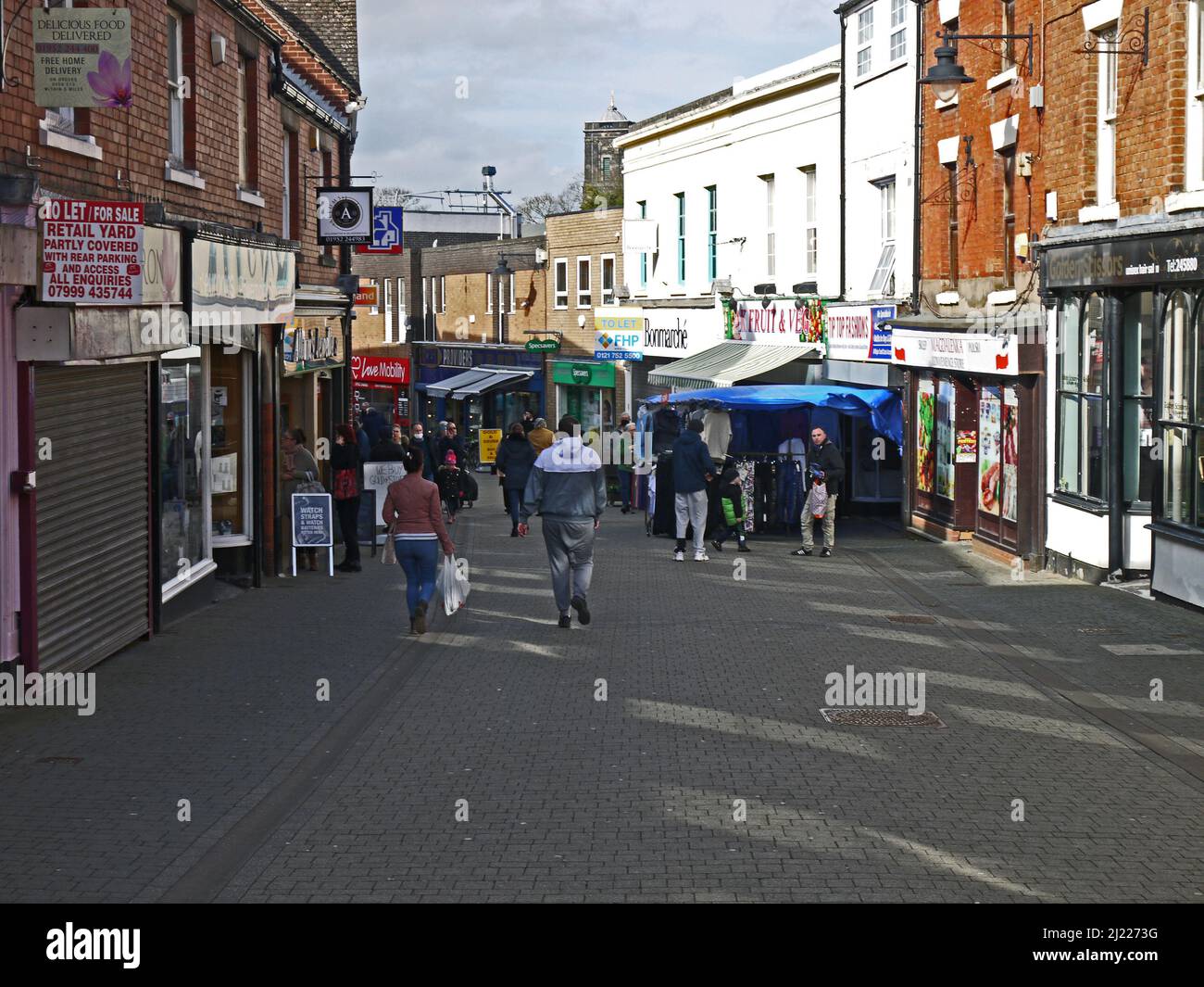 WELLINGTON. SHROPSHIRE. ENGLAND. 02-26-22. New Street. Shops with outdoor displays in the pedestrianized town centre. Stock Photo
