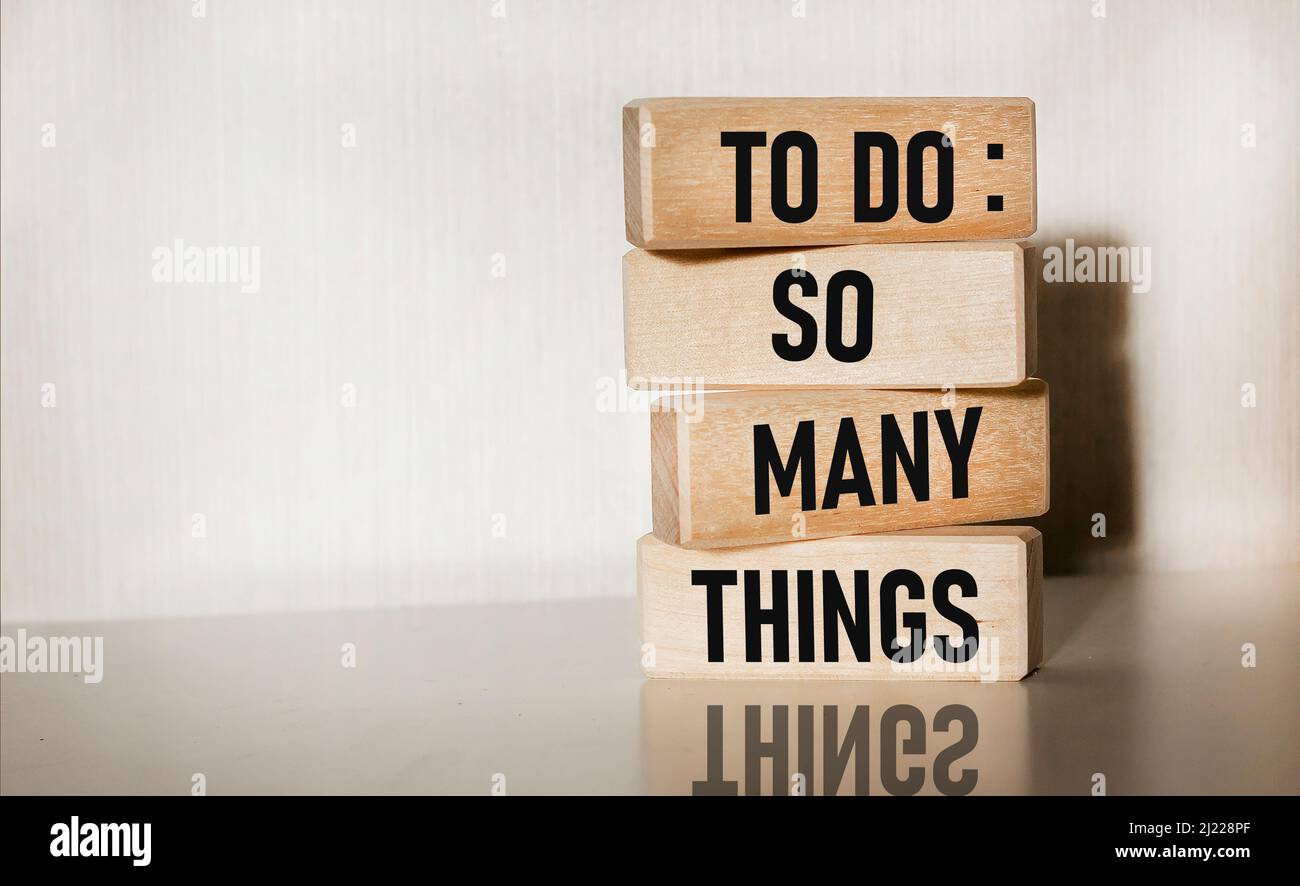 Text TO DO SO MANY THINGS written on wooden blocks Stock Photo