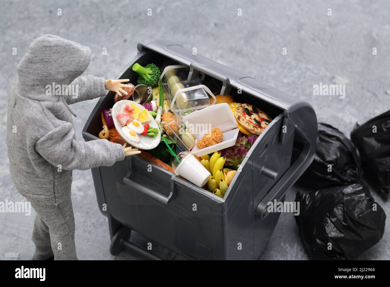 please don't waste food, world food day concept image made in miniature. Stock Photo