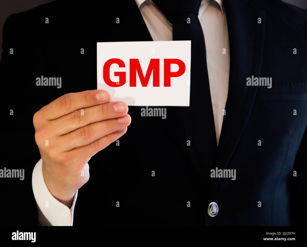 Businesswoman holding card with GMP message. concept Stock Photo - Alamy