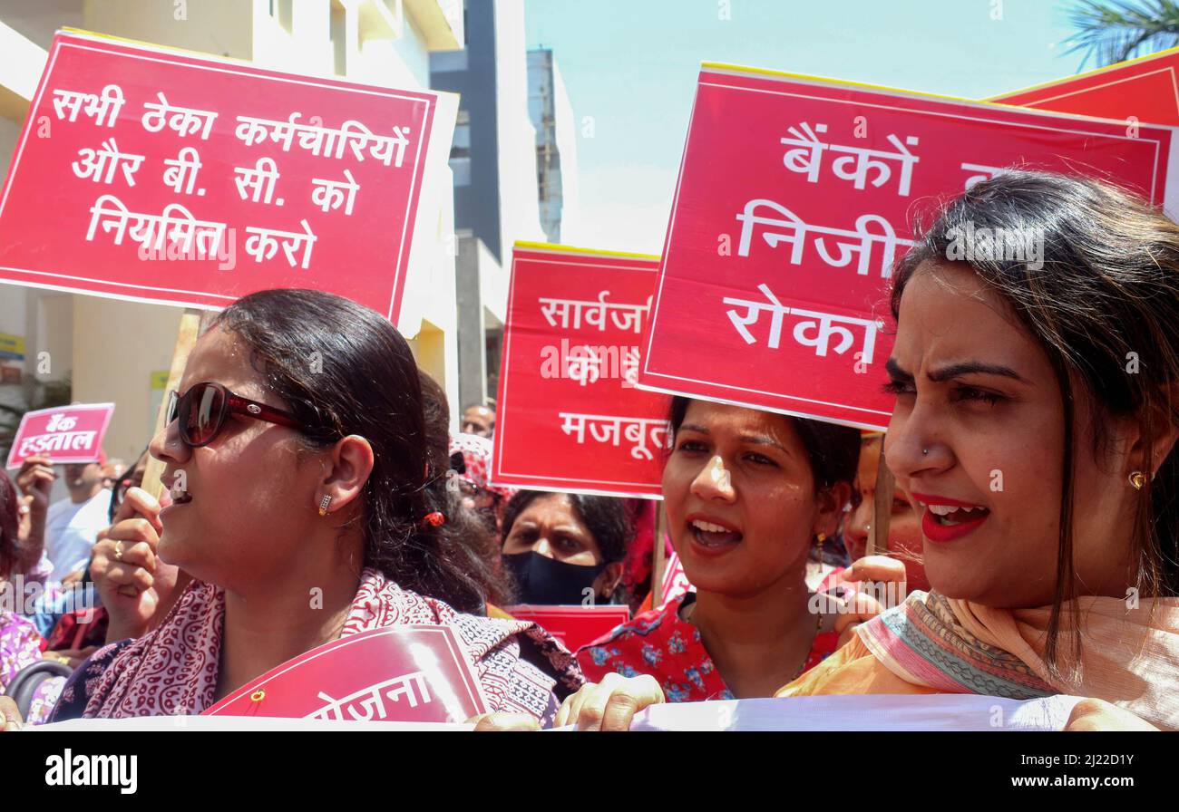 Protesters hold placards expressing their opinions during the demonstration. Under the aegis of All India Bank Employees' Association (AIBEA) in public sector banks, private banks, foreign banks, cooperative banks and regional rural banks, bank employees joined a two-day Bharat Bandh to protest against the Union government's anti-people economic policies and anti-worker labour policies. The strike began on Monday, March 28 from 6 am. It is likely to hit numerous sectors across the country, including banking, power, transportation, and more. Stock Photo