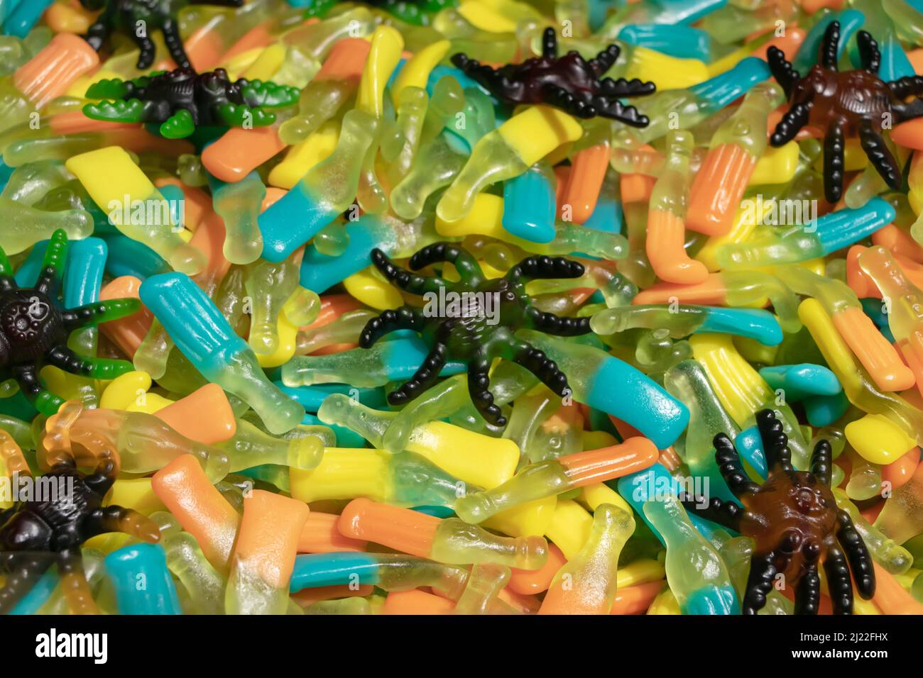 Colorful jelly candies in the form of worms. Candy background Stock