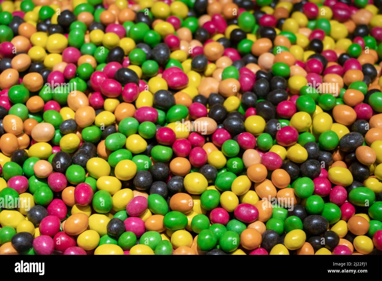 Multicolored jelly stick candies textured background. Stock Photo