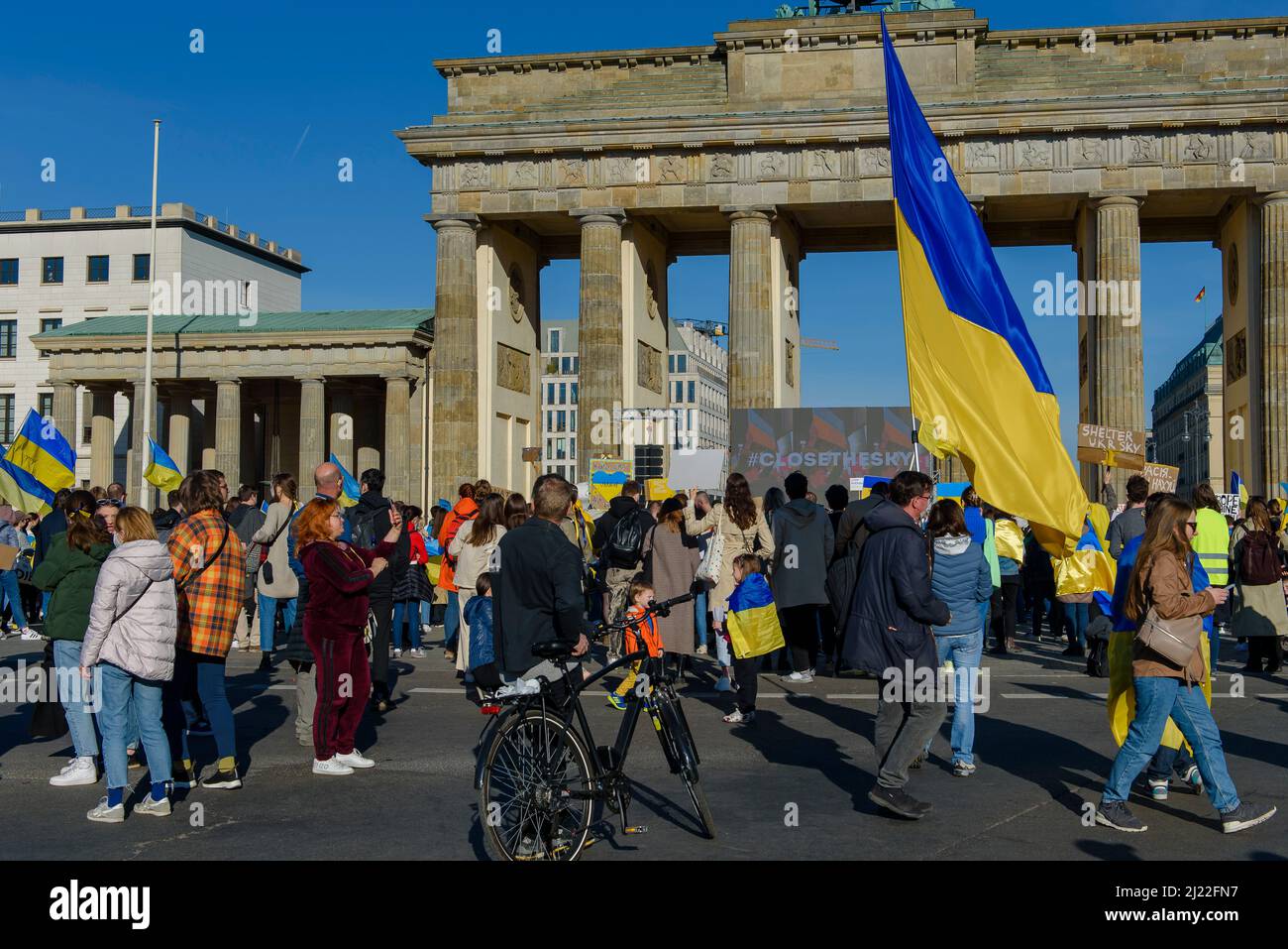 People in front of the Brandenburg Gate in Berlin Germany demonstrate against the war in Ukraine Stock Photo