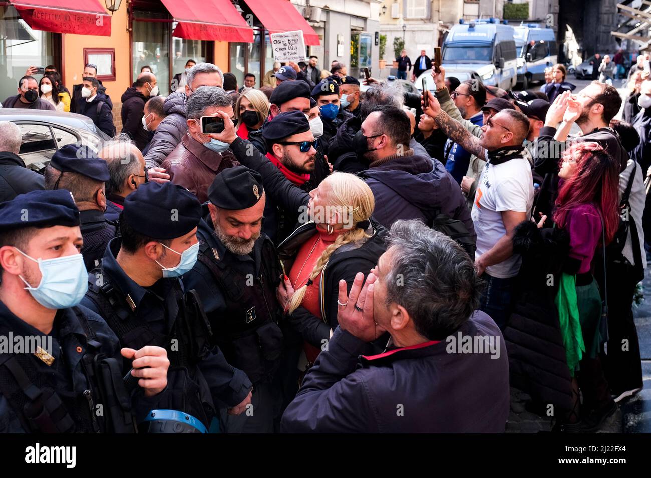 Mario Draghi outside a historic Neapolitan pizzeria is protested against by demonstrators, on the day of the signing of the pact for Naples, an agreement between the government and the city of Naples under which the state will pay about Û1.3 billion into the city's coffers over 20 years. Stock Photo