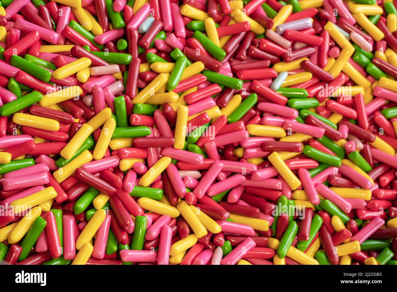 Multicolored jelly stick candies textured background. Stock Photo