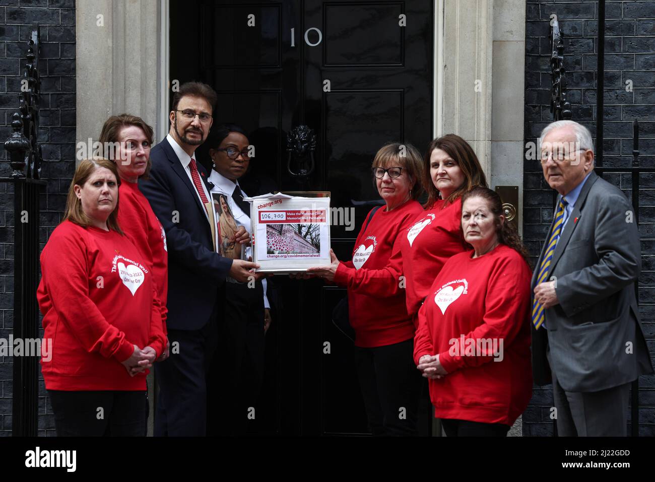 Members of the COVID-19 Bereaved Families for Justice UK stand outside 10 Downing Street on national day of reflection to mark the 1 year anniversary of The National Covid Memorial Wall creation, in London, Britain March 29, 2022. REUTERS/Tom Nicholson Stock Photo