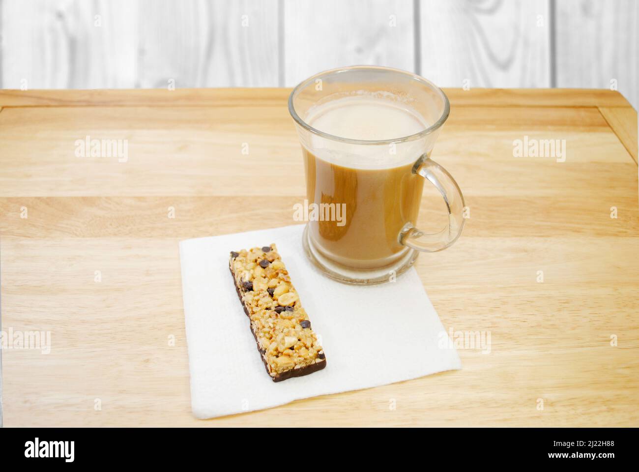 A Chocolate Chip Granola Bar with a Cup of Coffee for Breakfast Stock Photo