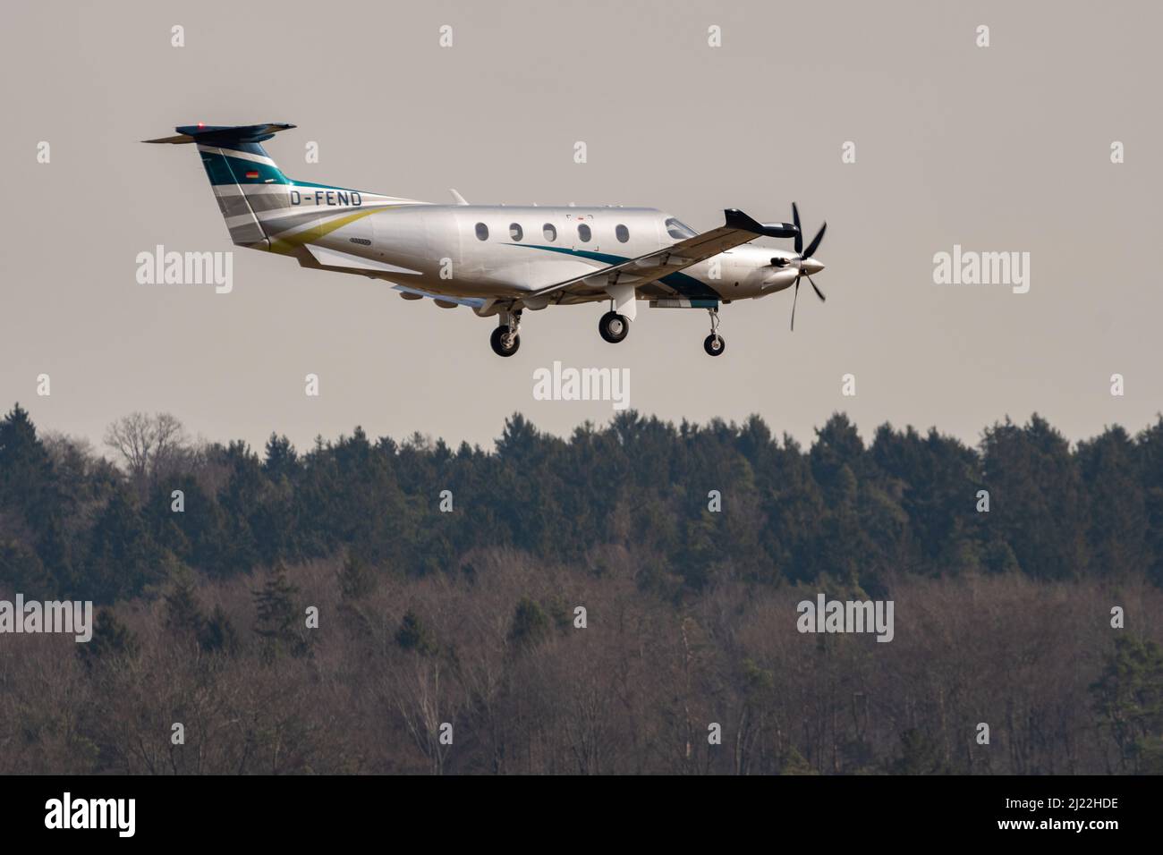 Zurich, Switzerland, February 24, 2022 Pilatus PC-12 propeller plane on its final approach on runway 14 Stock Photo