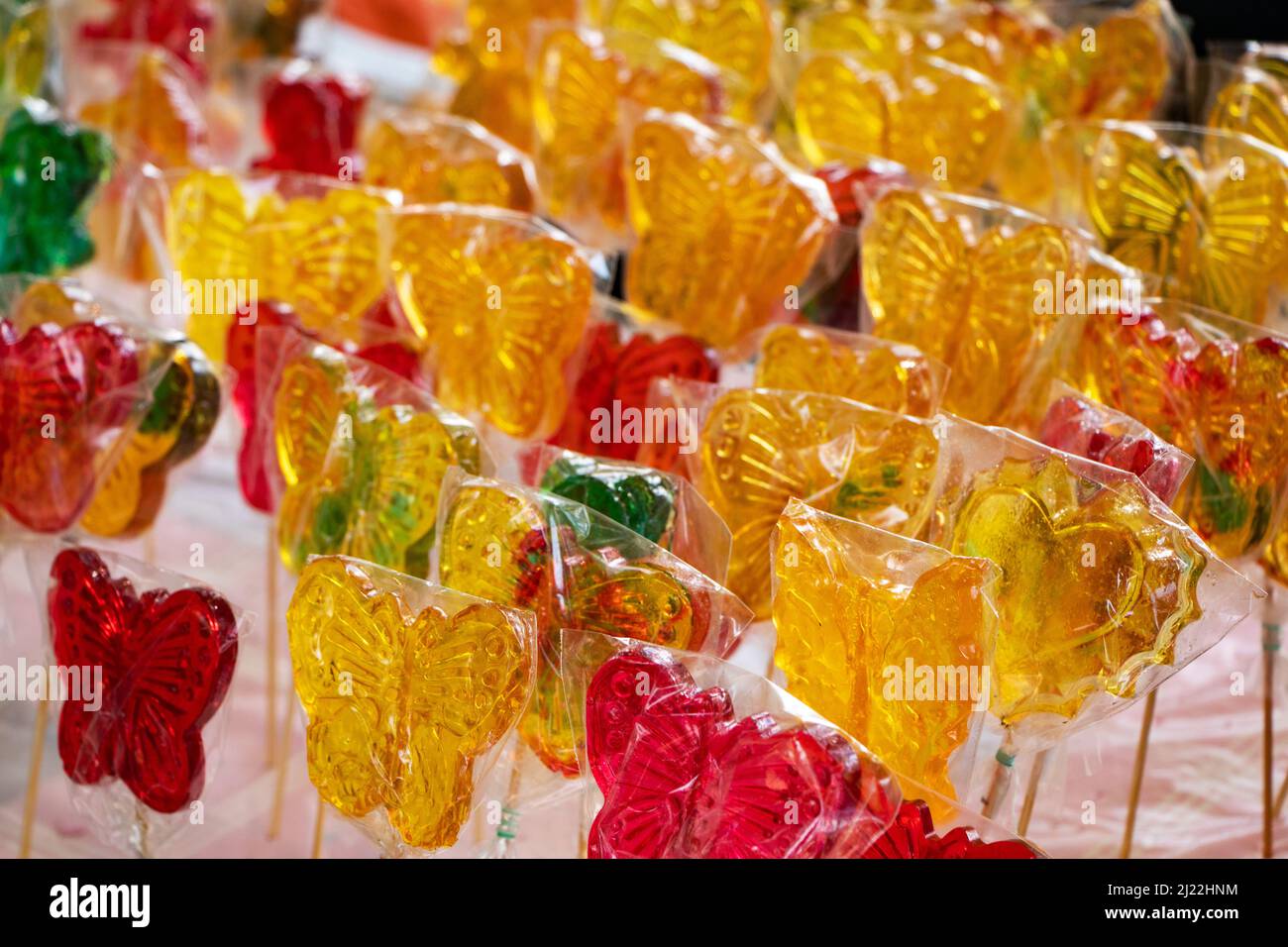 Colorful swirl lollipops at confectionery. Sweet candy for kids party