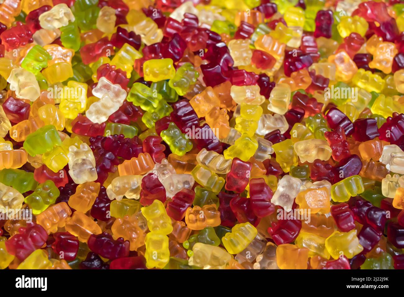 Multicolored jelly stick candies textured background. Stock Photo