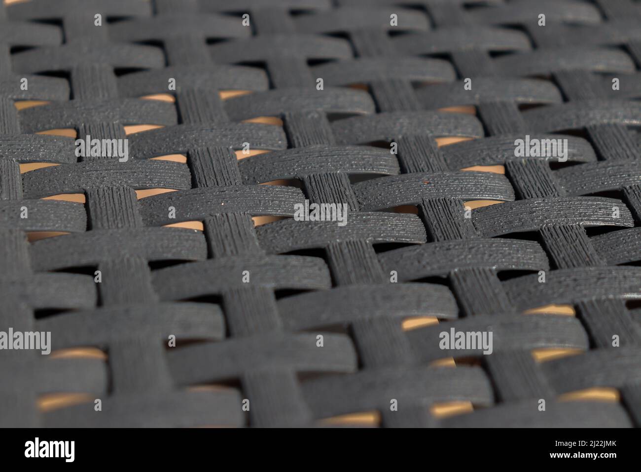 Mesh from plastic rattan garden furniture Stock Photo