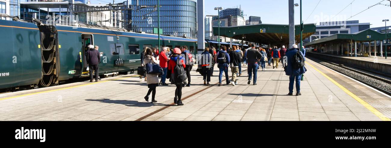 Cardiff, Wales - March 2022: People getting off a train after arriving at Cardiff Central railway station Stock Photo