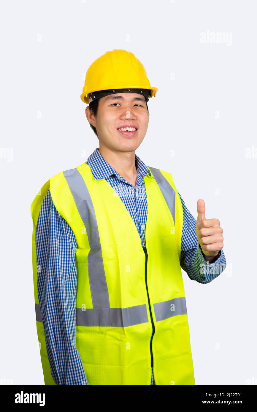 Young asian engineer smiling and thumbs up isolated on white background. (With Clipping path) Stock Photo