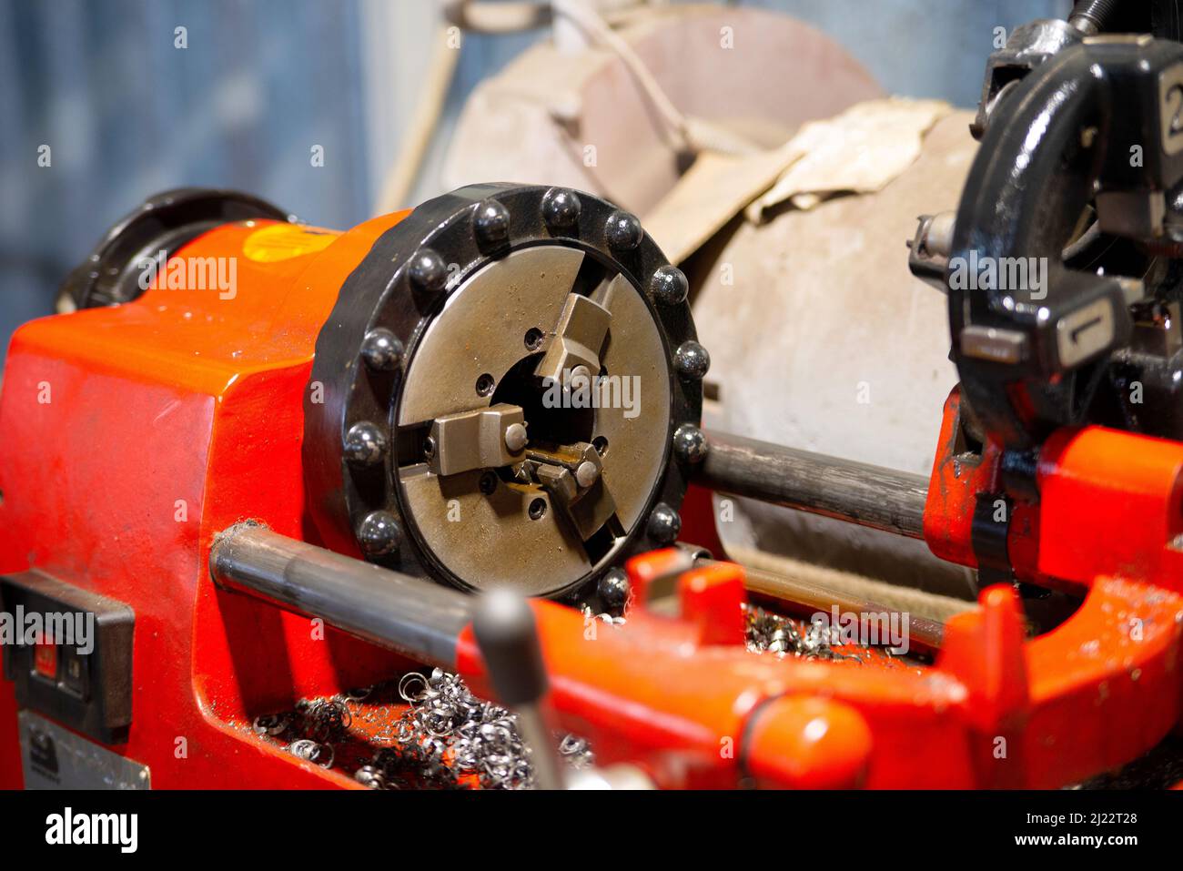Threejaw lathe chuck in threading machine Stock Photo Alamy