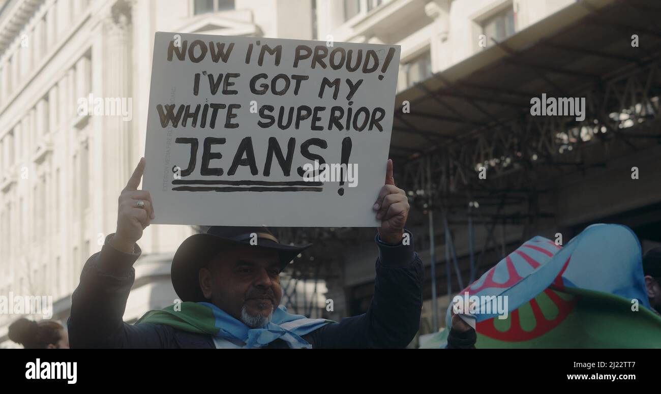 London, UK - 03 19 2022: Man on Regent Street holding sign at protest, 'Now  I'm Proud! I've Got My White Superior Jeans!', 'March Against Racism' Stock  Photo - Alamy
