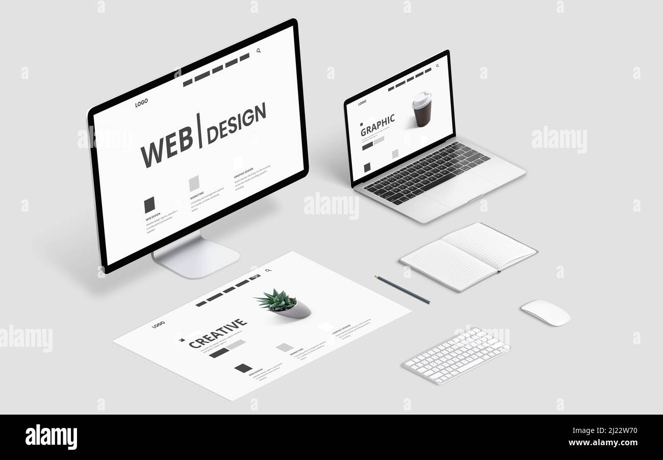 Isometric web design studio desk with computer display, laptop and concept page layout Stock Photo