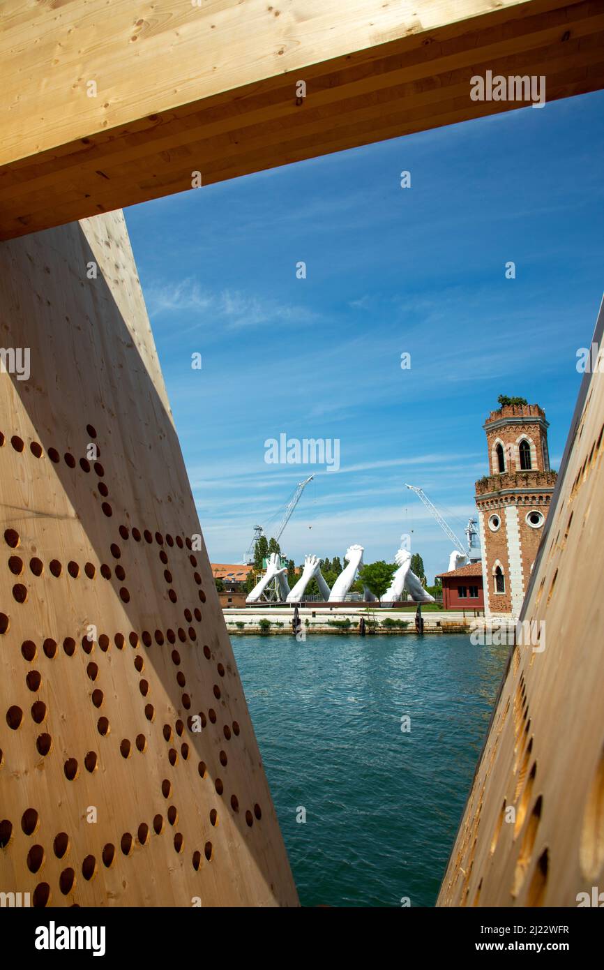 Venice, Italy - July 3, 2021: Lorenzo Quinn's Giant Stone Hands Represent Humanity’s Universal Values At Venice Art Biennale in Venice, Italy. Stock Photo