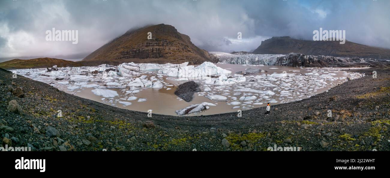 Glacier lake panoramic view with tourists Stock Photo