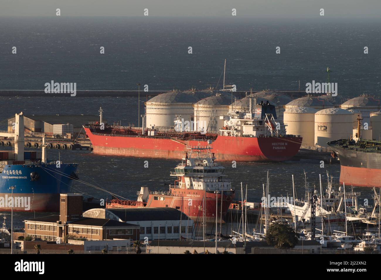 Cape Town, South Africa. 2022. Aerial view of oil storage tanks and tanker ship in the Port of Cape Town. Ship in the port. Stock Photo