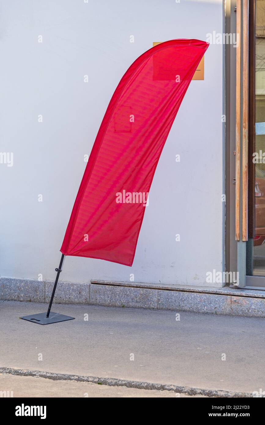 Self Standing Advertising Tear Drop Red Flag Pole Stock Photo