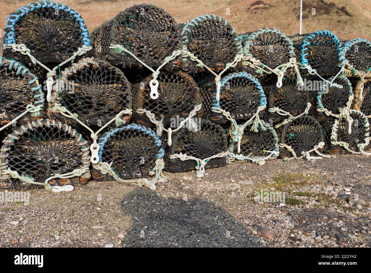 dh Fishermans creels DUNBEATH SUTHERLAND Fisherman lobster fishing crab pots on harbour pier quay creel isolated scotland Stock Photo