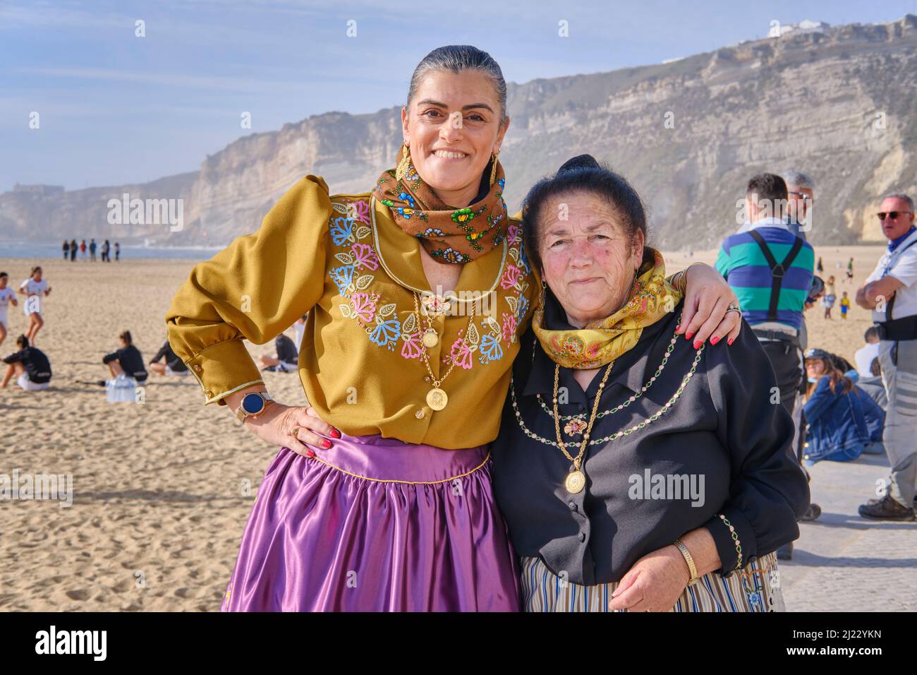 On a celebration day, women from Nazaré dress the traditional outfit. Colourful dresses with seven skirts. Nazaré, Portugal Stock Photo