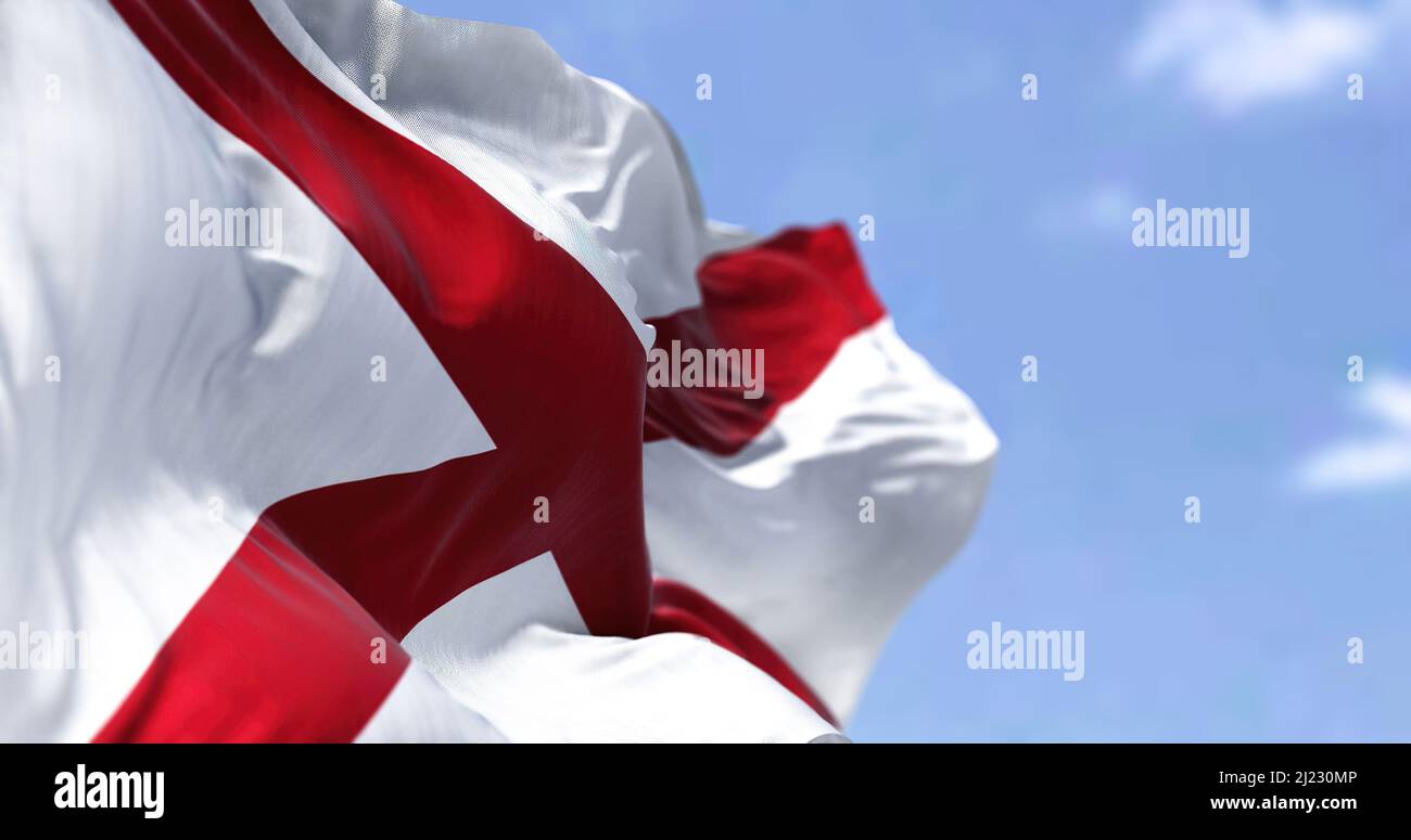 The state flag of Alabama waving in the wind. Democracy and independence. American state. Stock Photo
